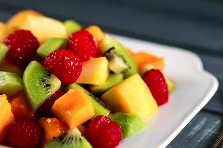 Mango Kiwi Raspberry Salad - Raw, healthy, delicious! Whip this one in under 10 mins - no excuse not to eat healthy! | ScrambledChefs.com