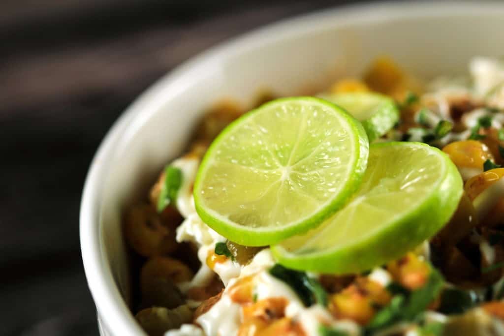 Creamy Mexican Corn Salad (Esquites) - This super easy and delicious salad is going to win your heart! Tastes completely authentic and will be ready in no time!! | ScrambledChefs.com