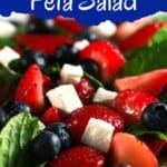 Strawberry blueberry feta salad in white bowl