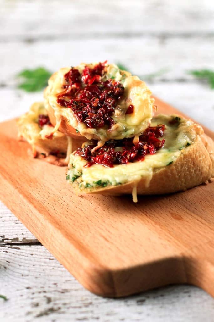 Sundried Tomatoes and Garlic Butter Bruschettas - This recipe is SO easy to make! It even shows you how to make sundried tomatoes at home - YUM! Prep in advance and have these all week!! | ScrambledChefs.com