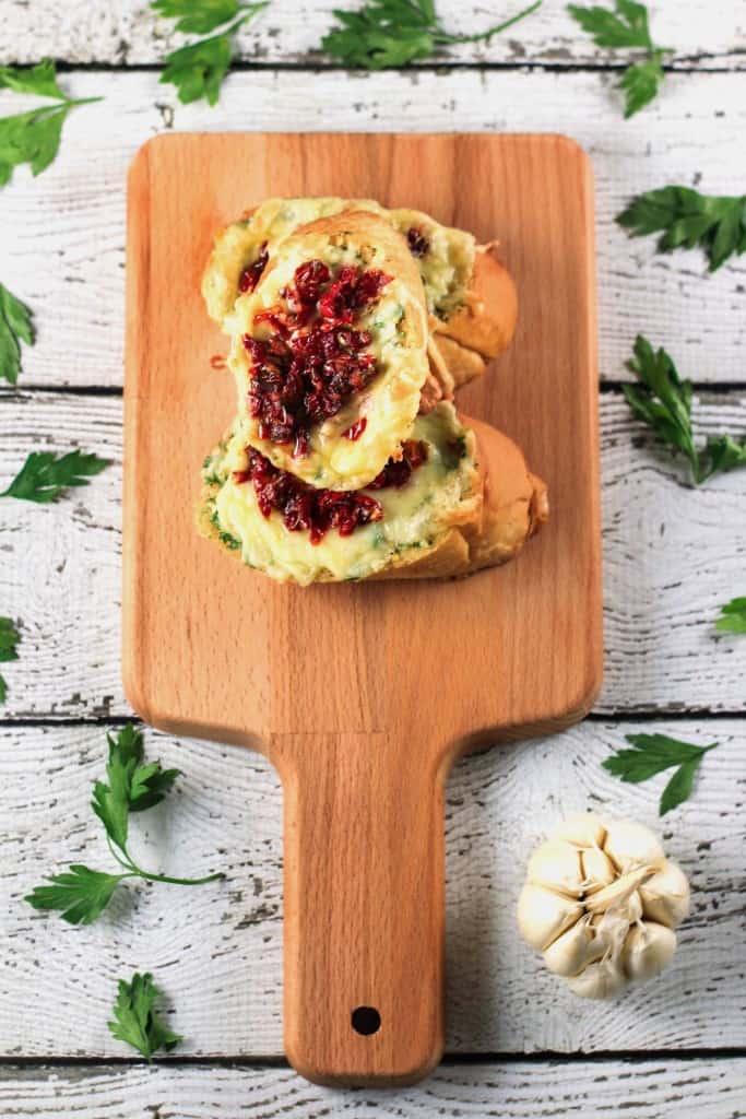 Sundried Tomatoes and Garlic Butter Bruschettas - This recipe is SO easy to make! It even shows you how to make sundried tomatoes at home - YUM! Prep in advance and have these all week!! | ScrambledChefs.com
