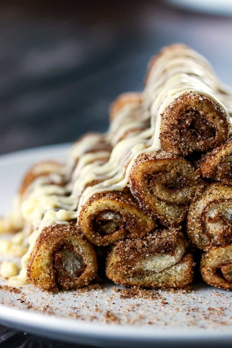 Easy Cinnamon Roll French Toast Rolls Ups - These easy cinnamon roll french toast roll ups will satisfy your cravings in a jiffy! These are perfect for breakfast, but hey, we can have them all day! | ScrambledChefs.com