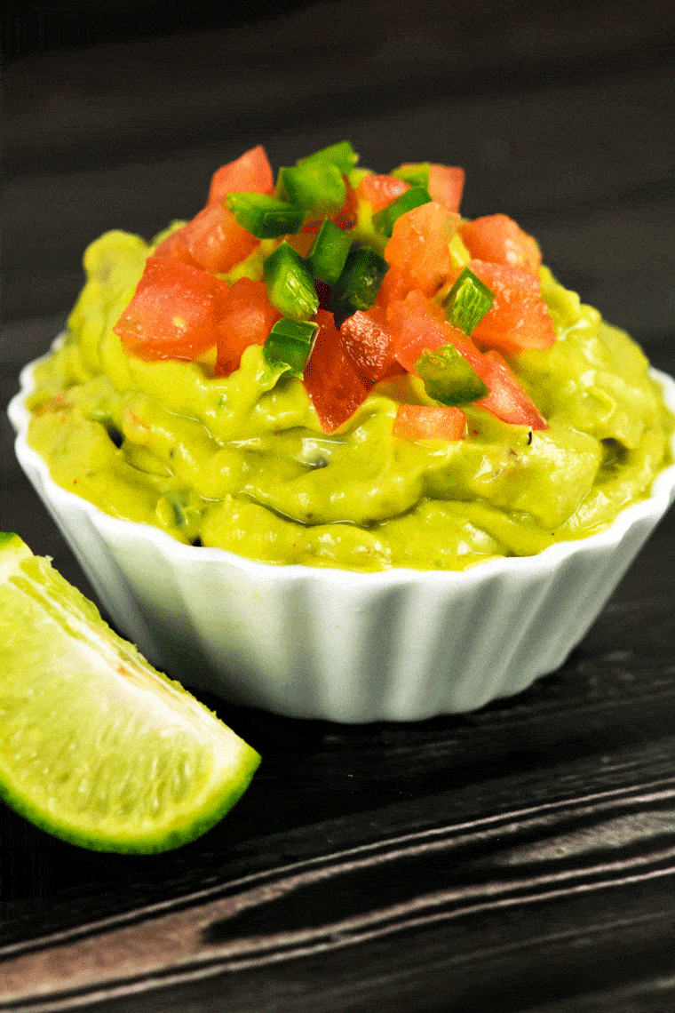 Tangy Homemade Guacamole Dip - This Tangy Homemade Guacamole dip will be the only guacamole recipe you'll ever refer to!! It's creamy, tangy and just perfect! Who needs store bought guacamole when the homemade one can be so easy and delicious?!| ScrambledChefs.com