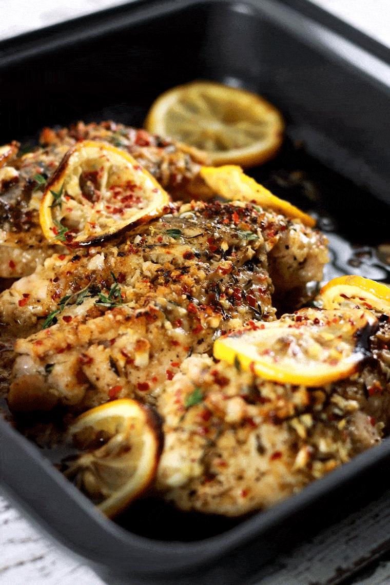 Baked Stuffed Chicken Breast with Lemon Garlic Spices - This recipe is absolutely PACKED with flavors! You won't believe how these simple spices can give a flavor so complex and rich!! Each bite is bursting with zesty garlic taste topped off with parmesan! | ScrambledChefs.com