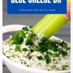 Blue cheese dip with celery in white bowl