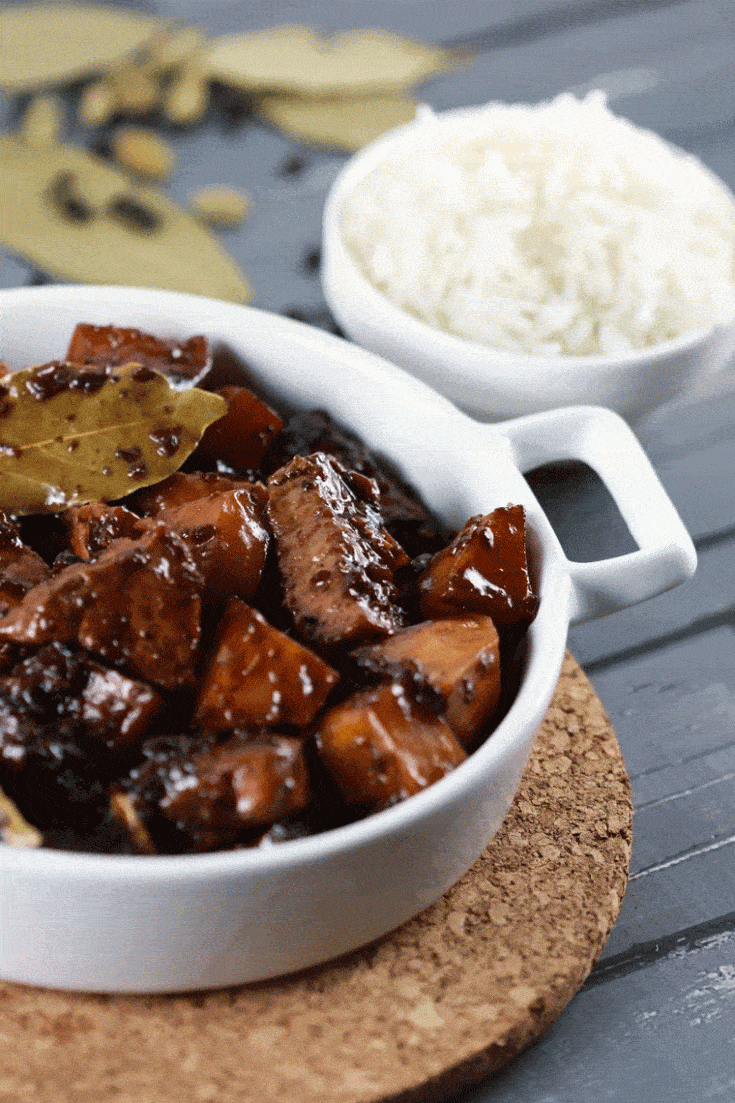 Filipino Pork Adobo - This widely popular Filipino dish is popular for a GOOD reason!! It uses extremely simple ingredients, is easy to make and tastes exquisite! | ScrambledChefs.com