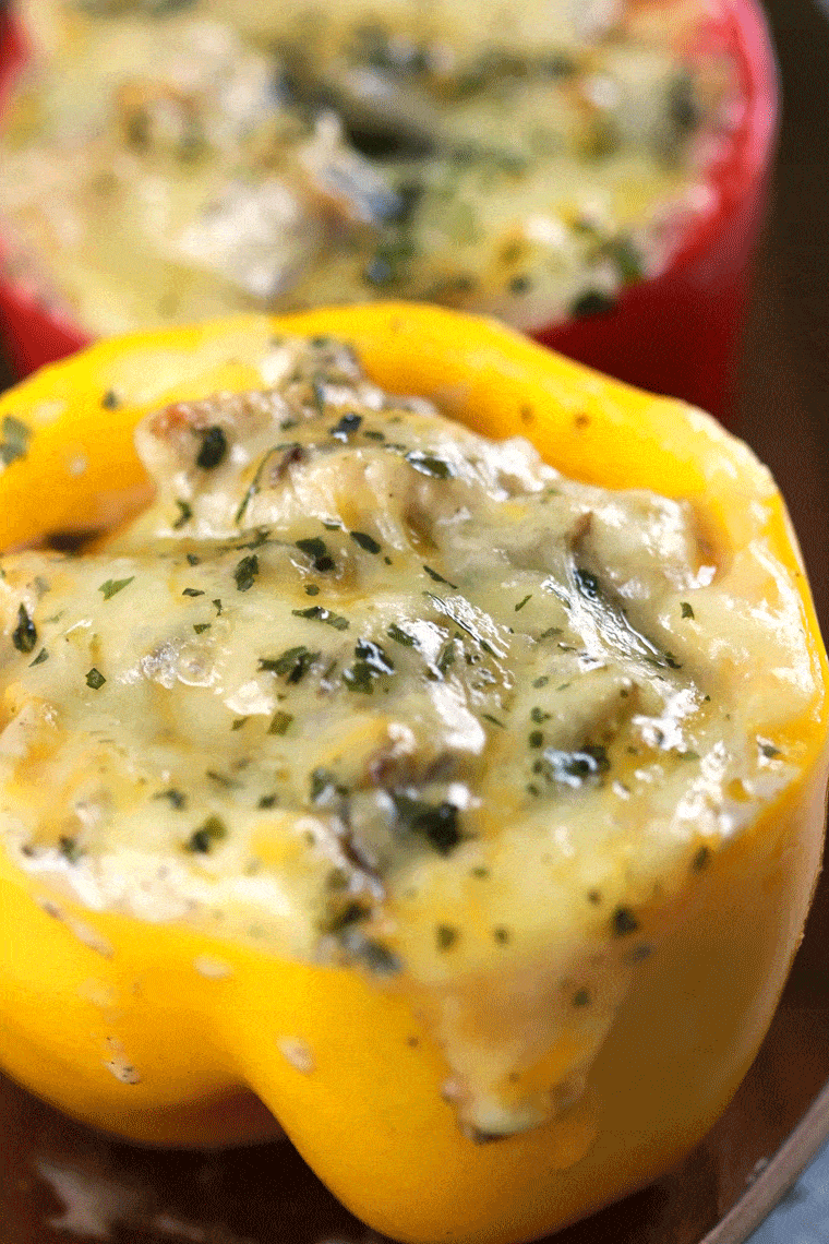 Stuffed Bell Peppers with Creamy Mushroom Chicken - These stuffed bell peppers have the most creamy mushroom sauce. Super quick to make and it'll instantly become a hit around the dinner table! | ScrambledChefs.com