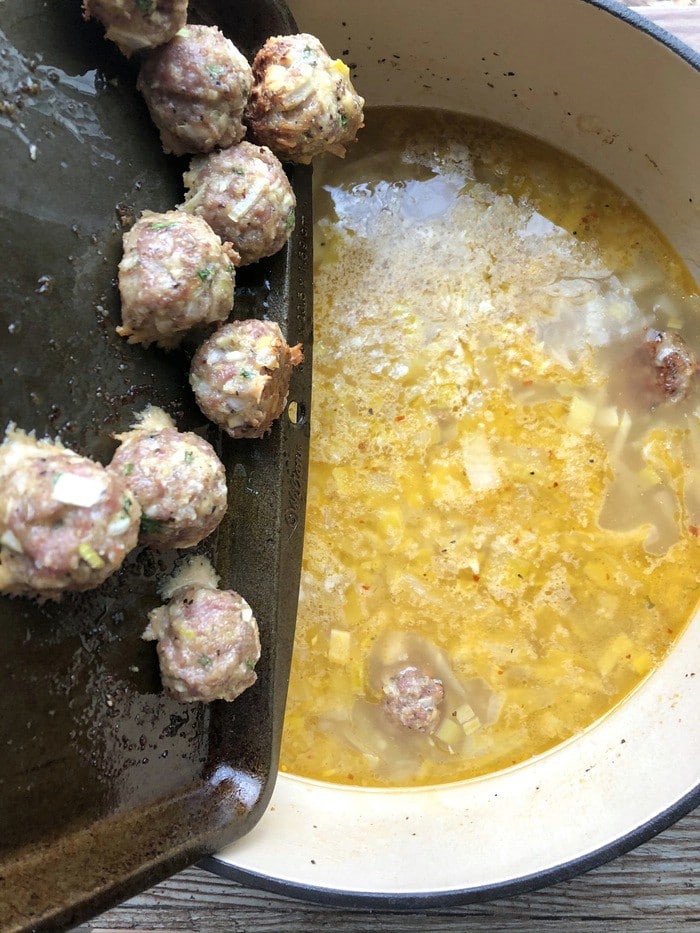 Adding meatballs to Italian wedding soup
