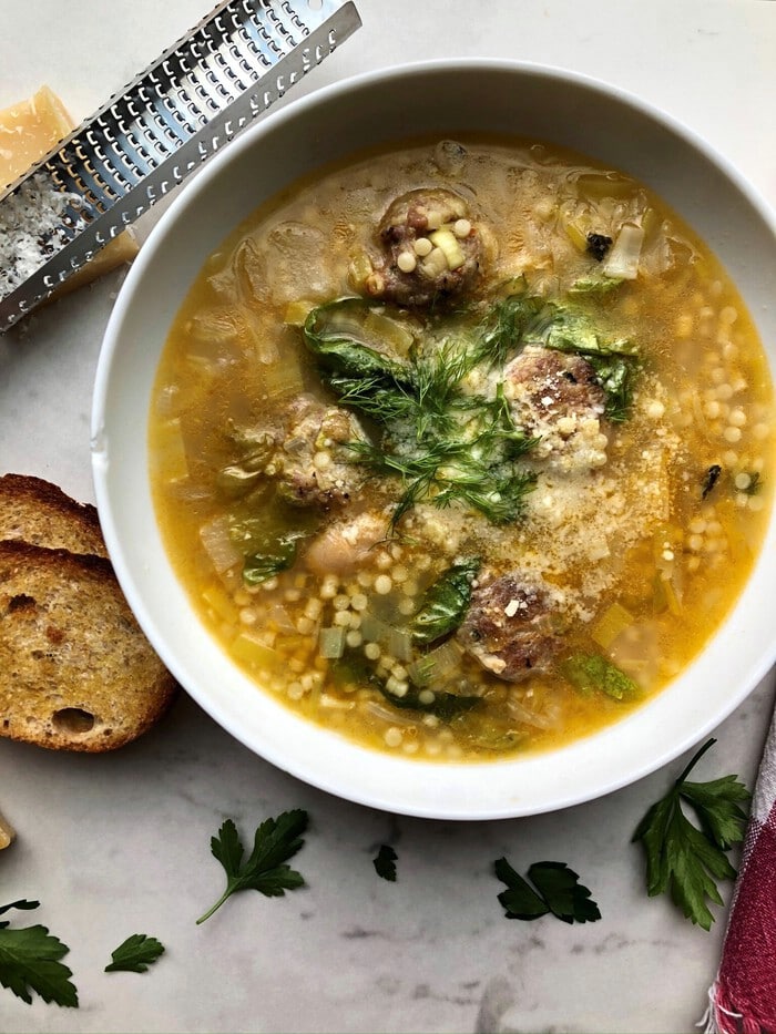 White bowl filled with Italian wedding soup