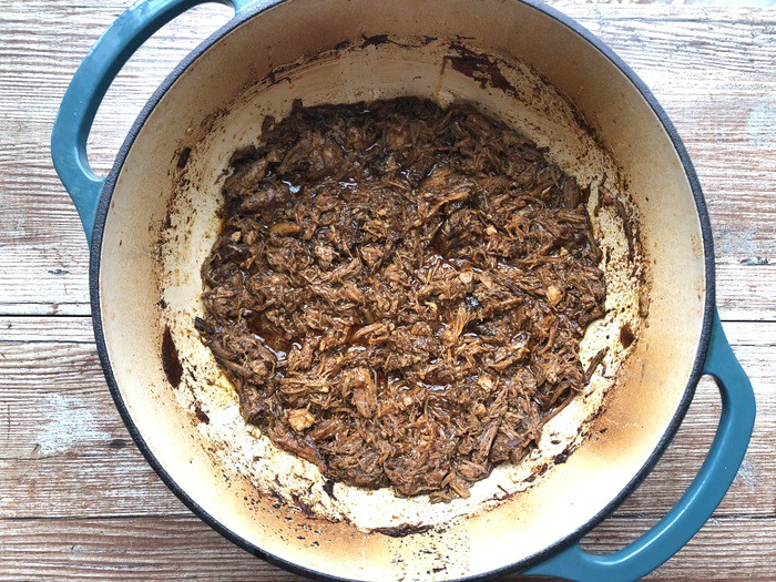 Dutch oven filled with braised pork