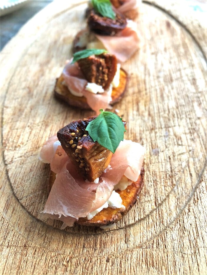 Up close sweet potato slice with proscuitto and figs