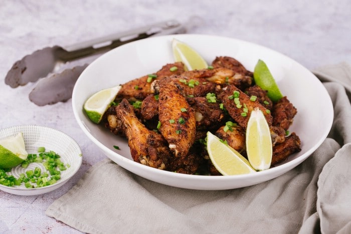Salt and pepper chicken wings in white bowl