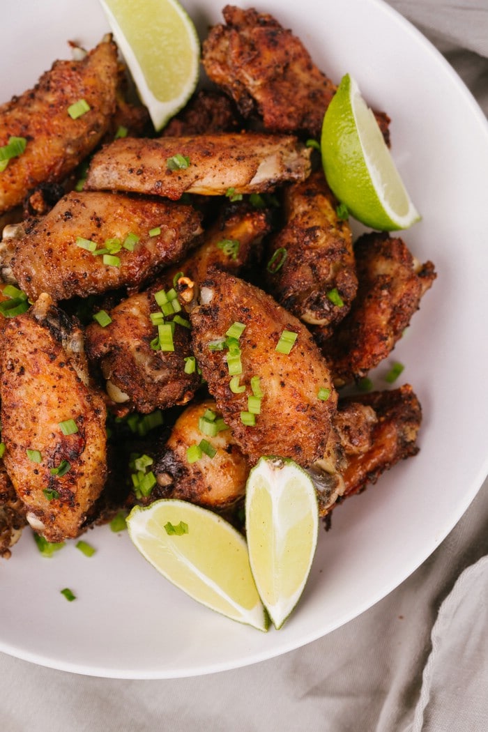 Baked chicken wings on white bowl