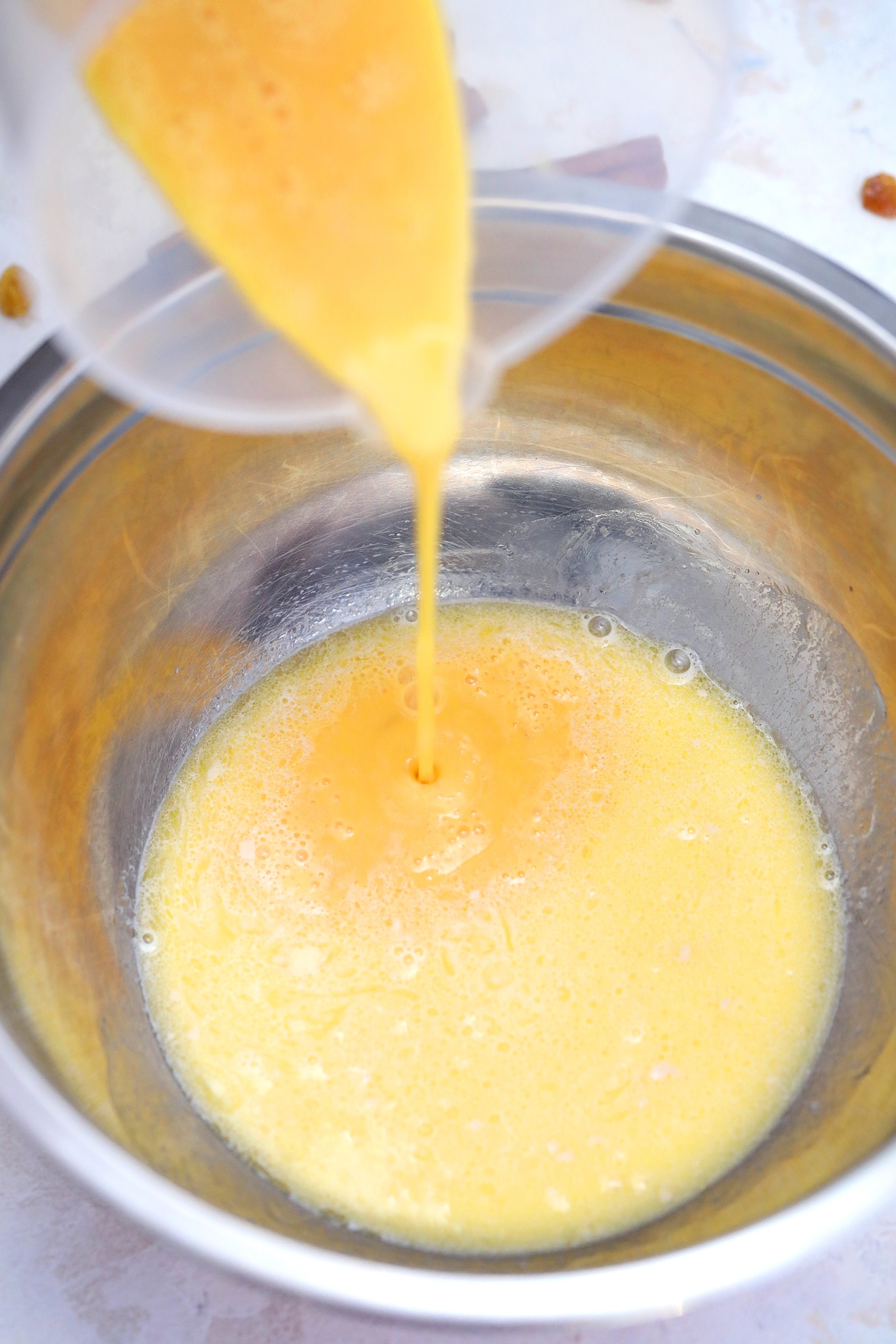 Adding eggs into yeast mixture