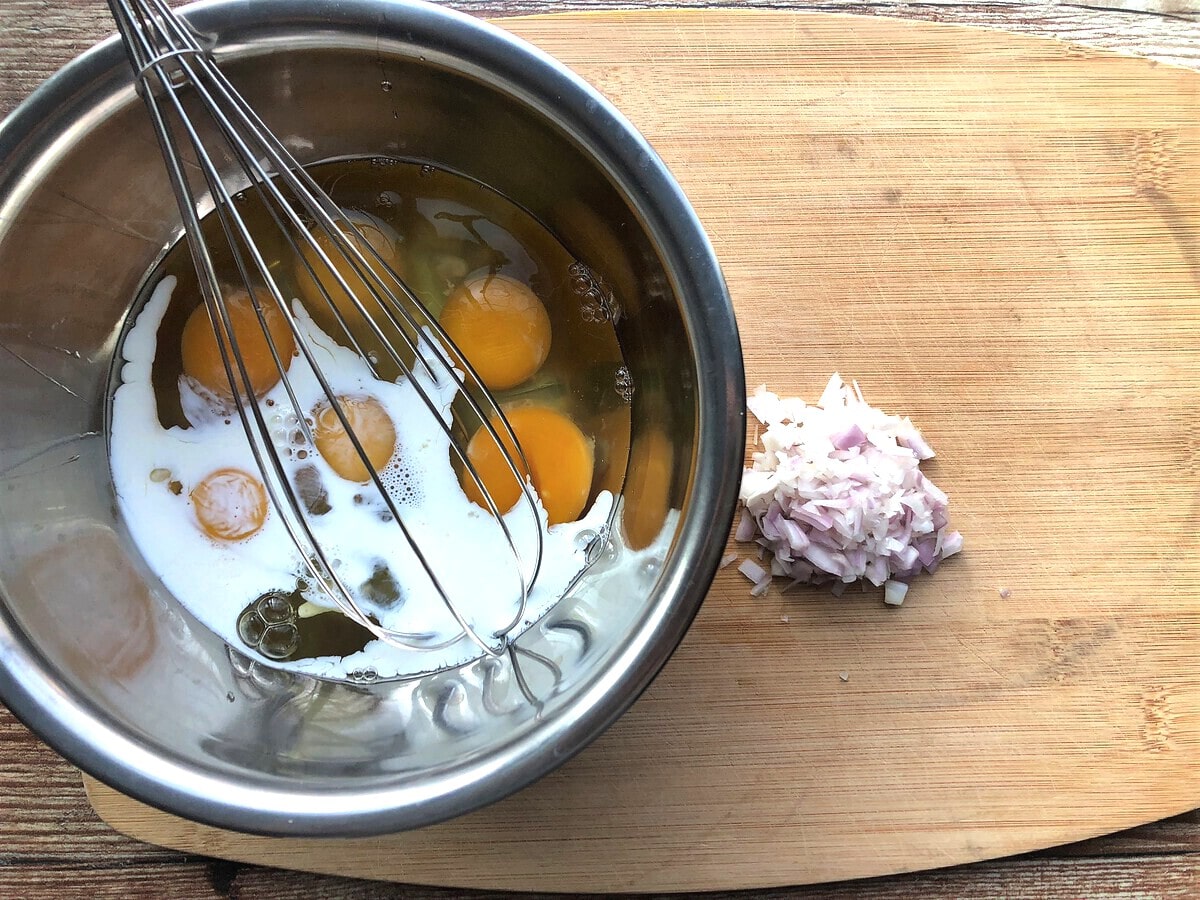 Whisking eggs in large bowl