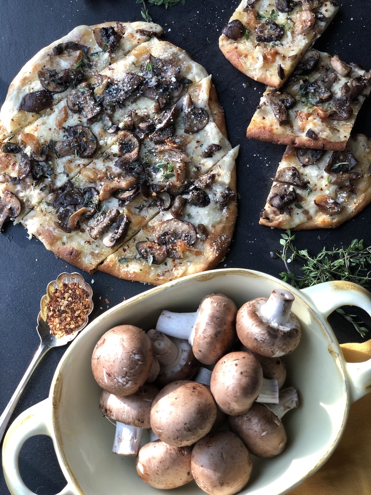 Naan flatbread with bowl of mushrooms