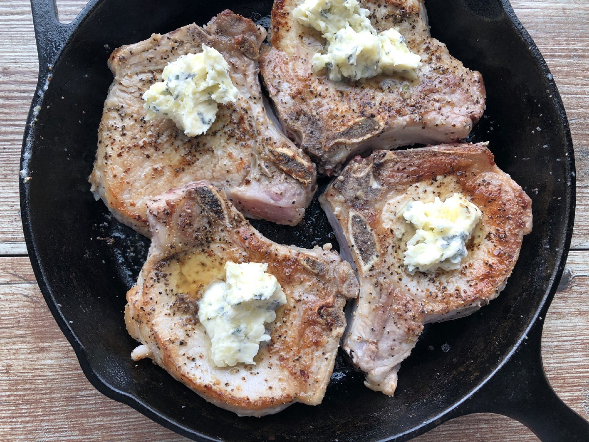 Seared pork chops coated in garlic butter
