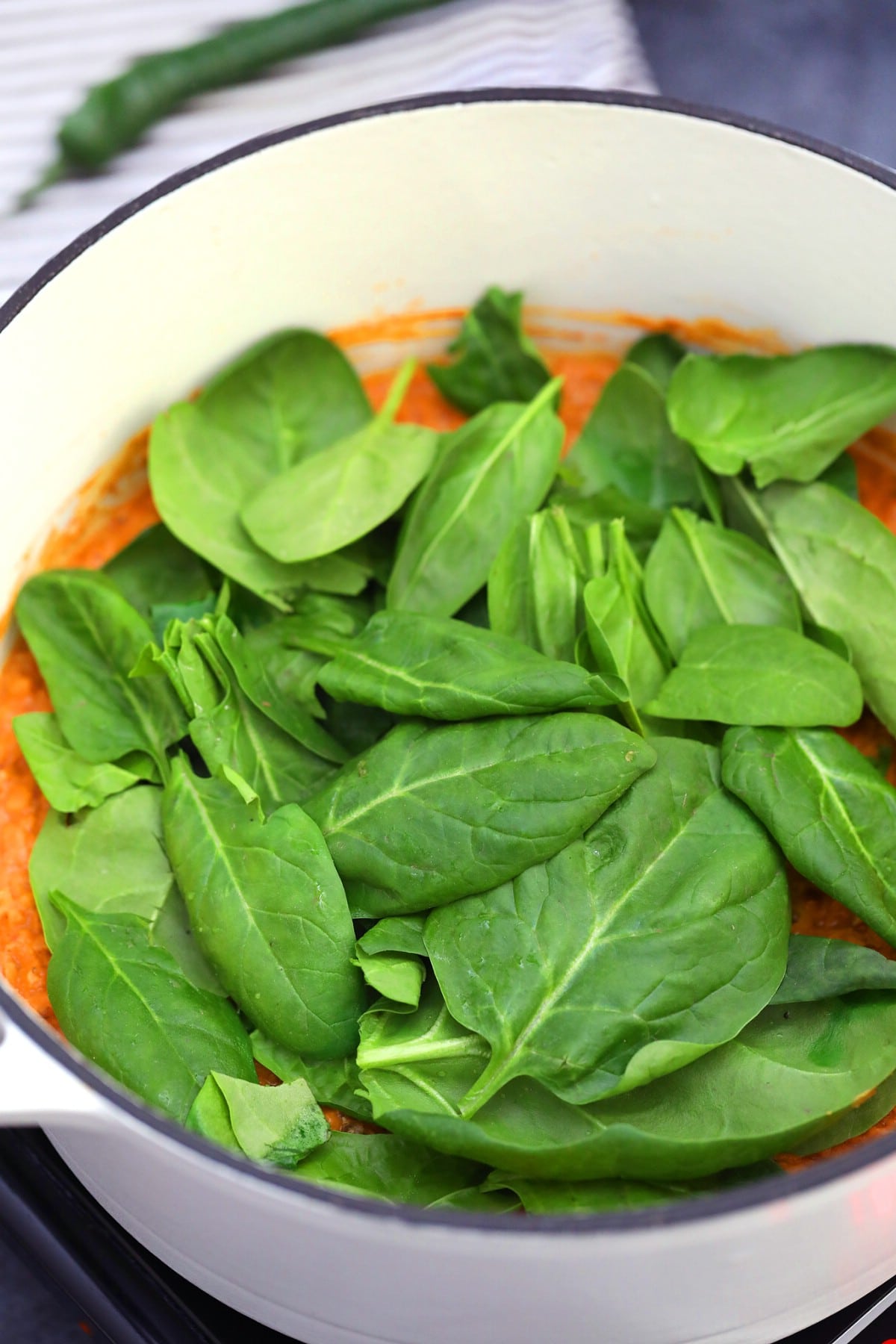 Adding spinach to dutch oven