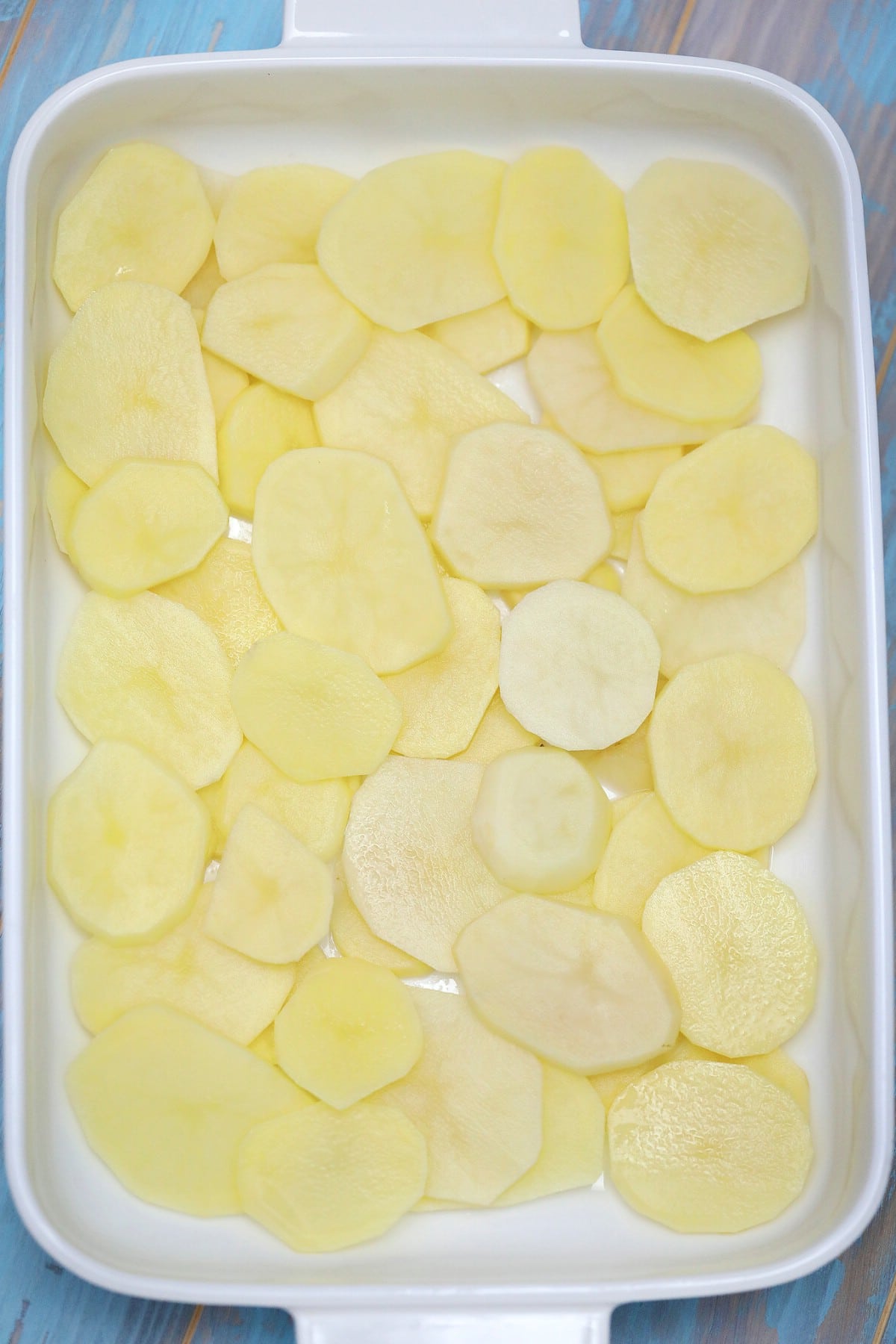 Potatoes layered in casserole dish