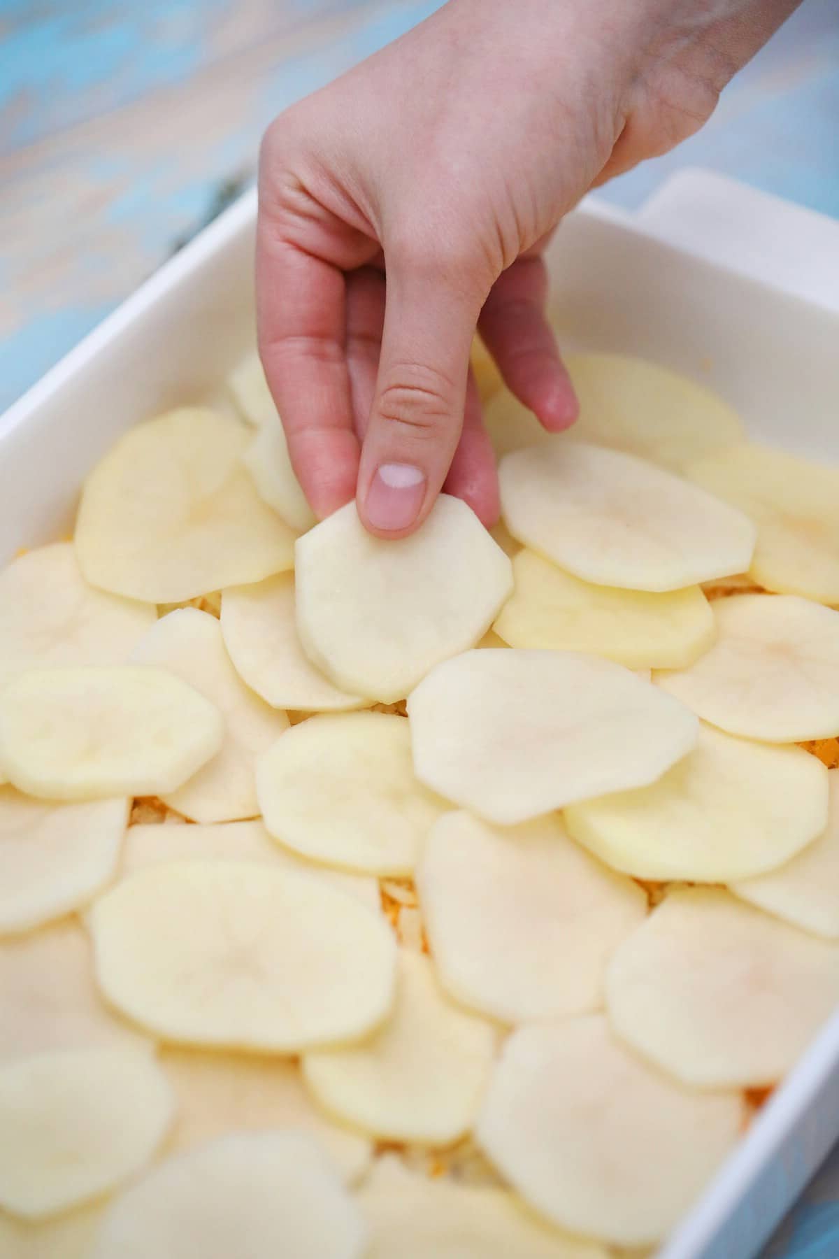 Adding potatoes to casserole