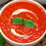 Tomato soup in white bowl