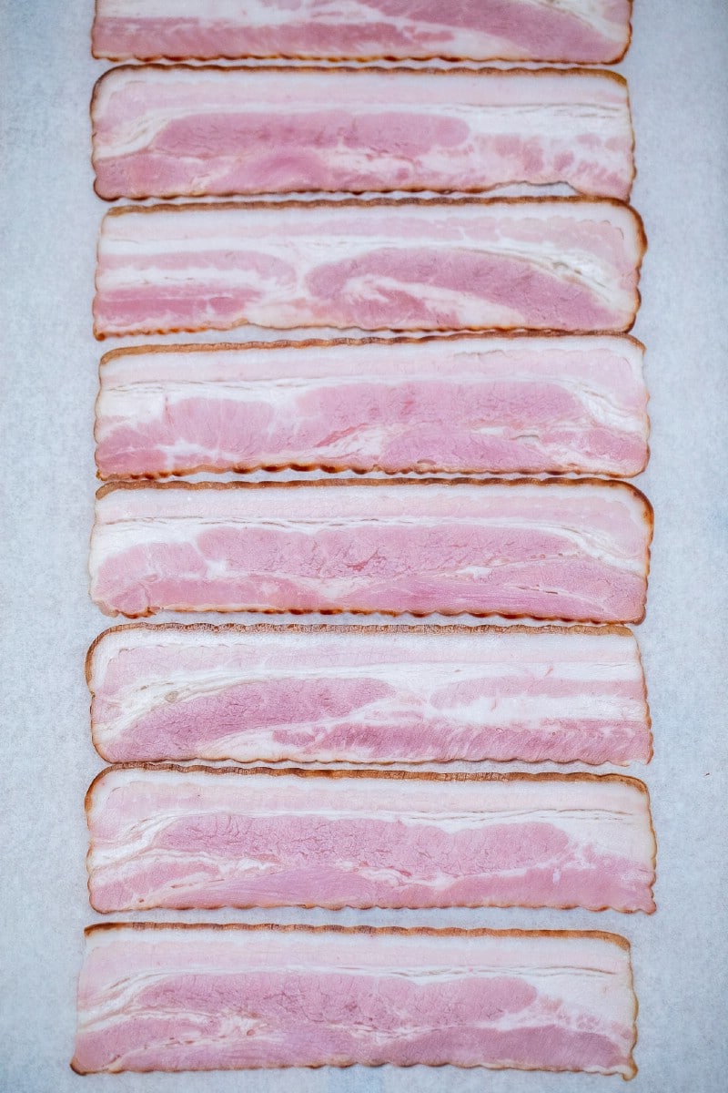 Raw bacon on tray