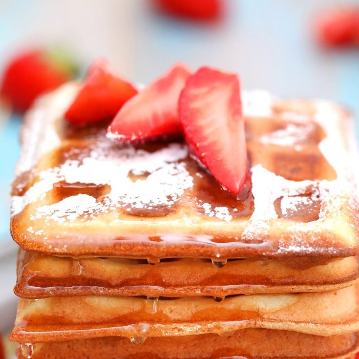Stack of belgian waffles with strawberries
