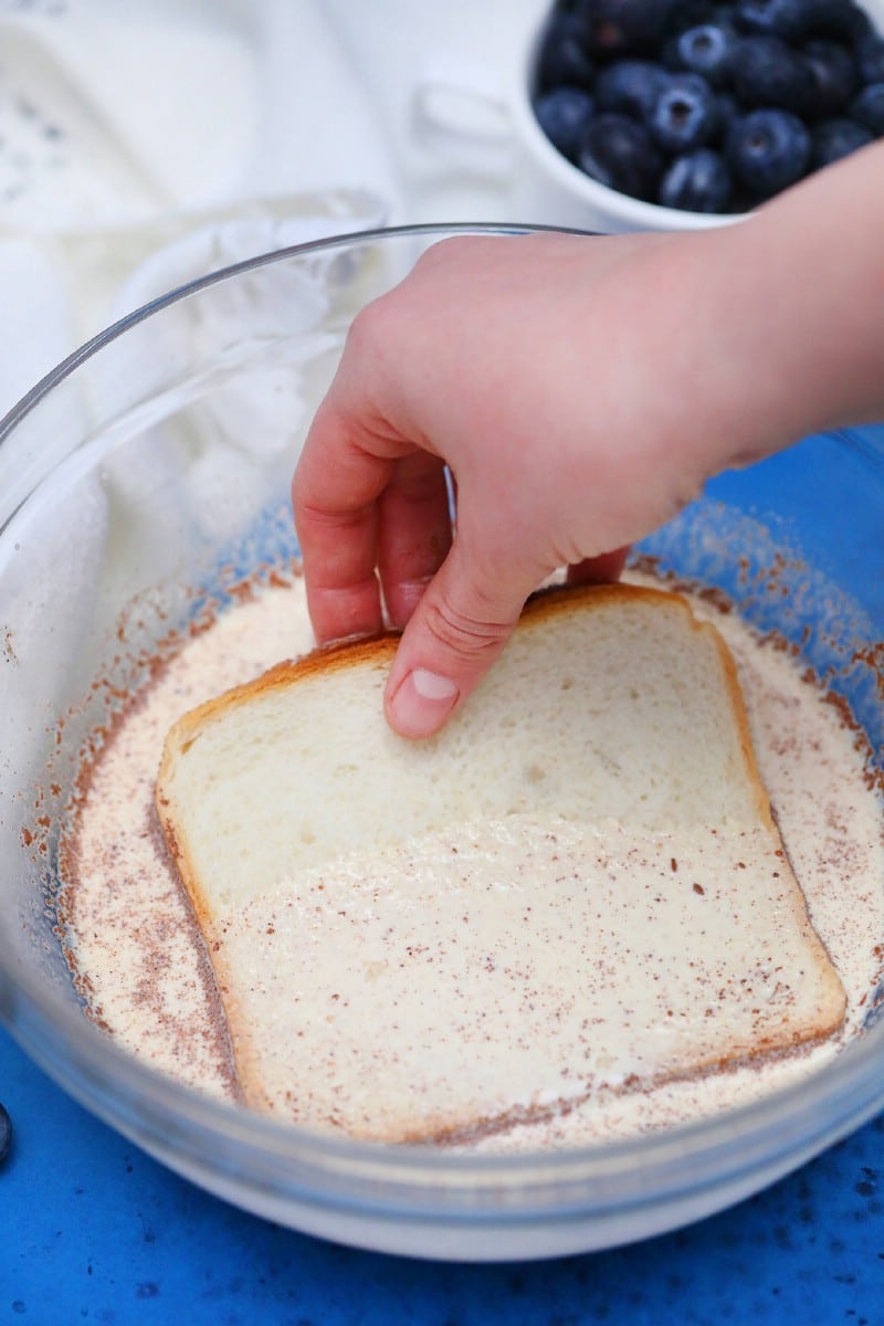 Dipping bread in egg mixture