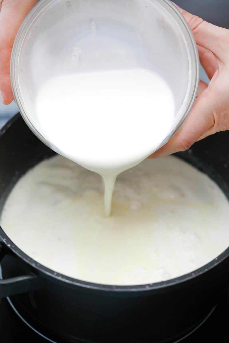Pouring milk into roux