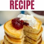 Flapjack topped with jam and whipped cream