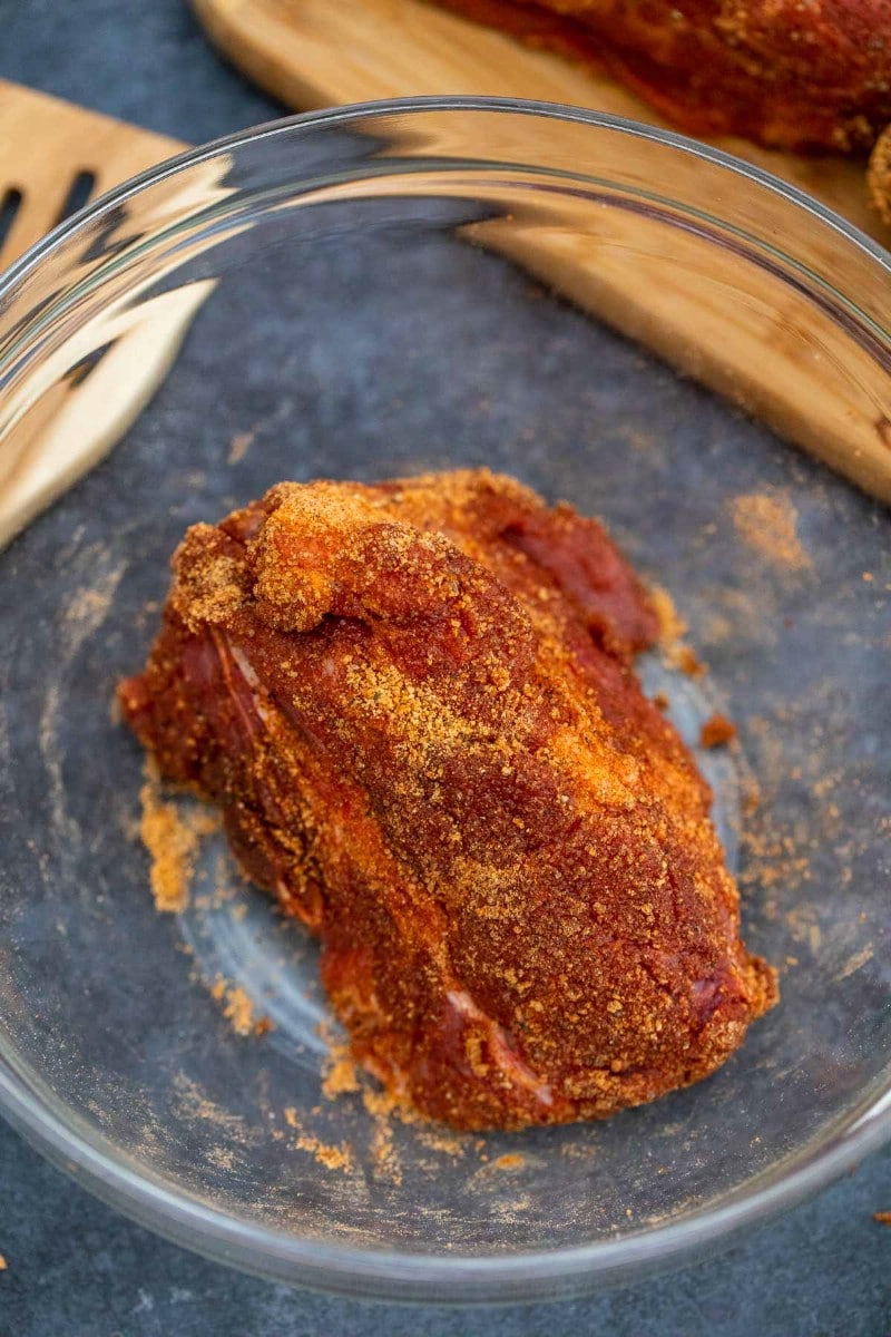 Coating pork butt with spice blend