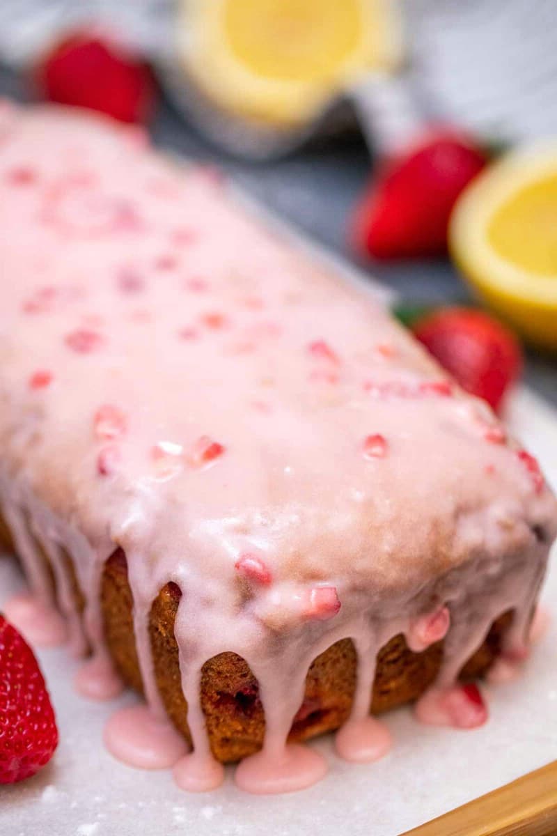 Loaf of strawberry bread topped with glaze
