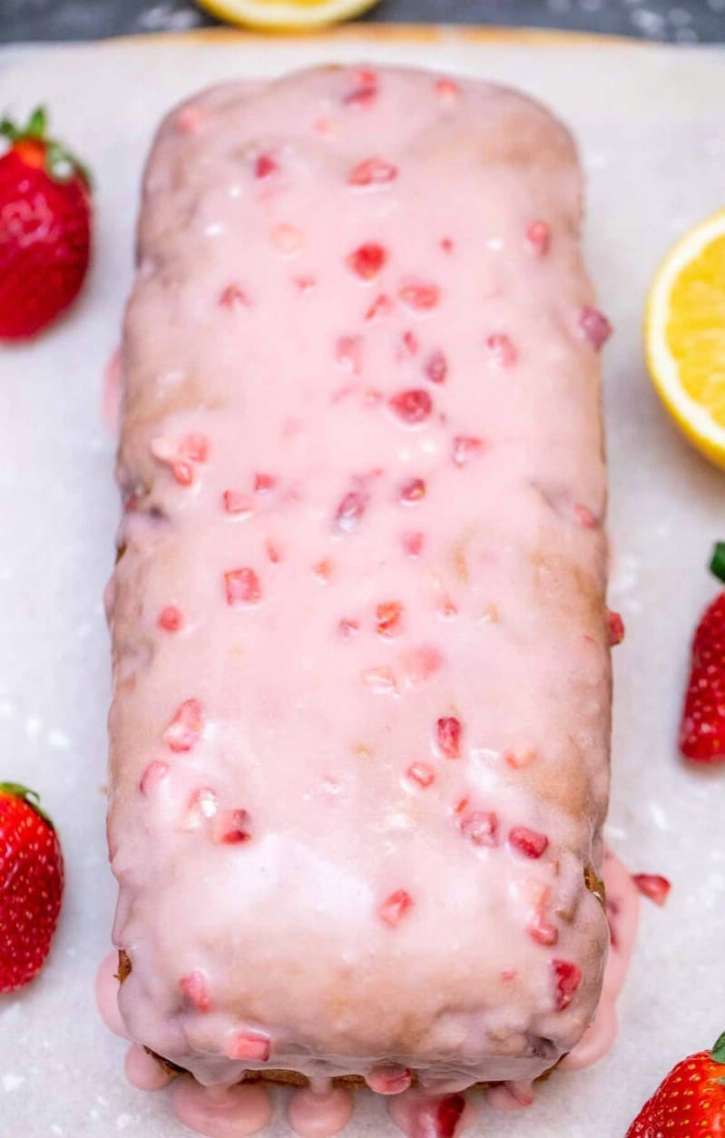 Loaf of strawberry bread topped with glaze