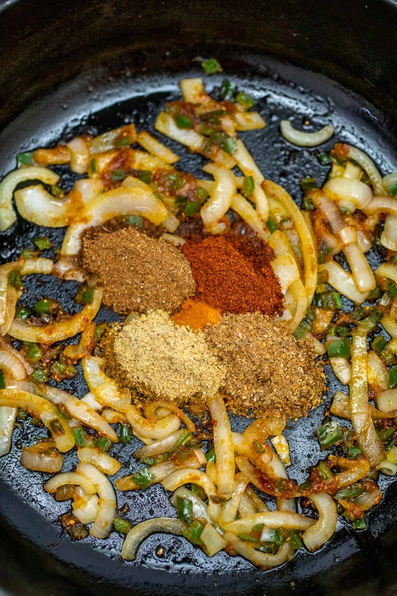 Spices and onions in skillet