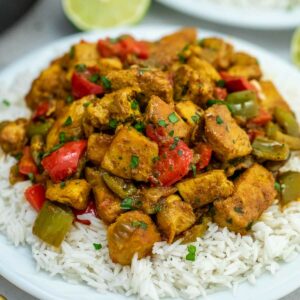 Jamaican chicken curry on plate with rice