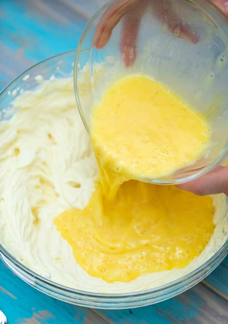 Adding eggs to cream cheese