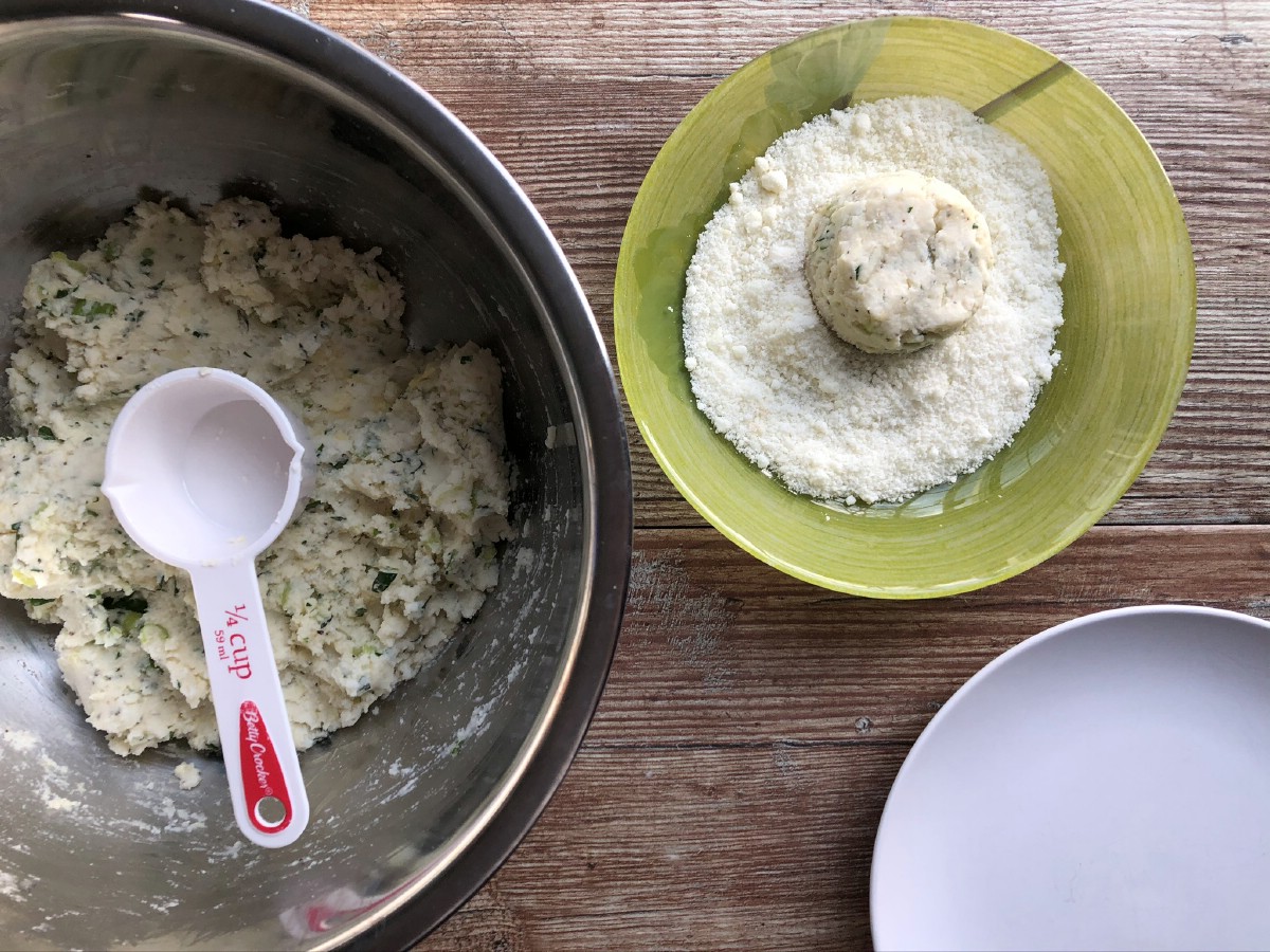 Rolling mashed potatoes in flour