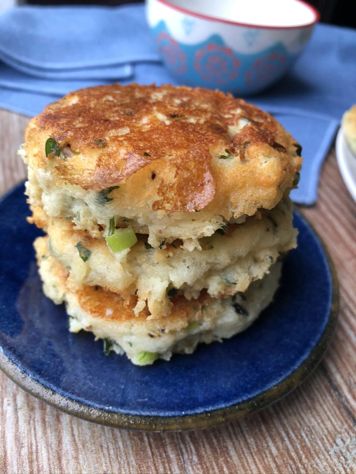 Stack of potato cakes on blue plate