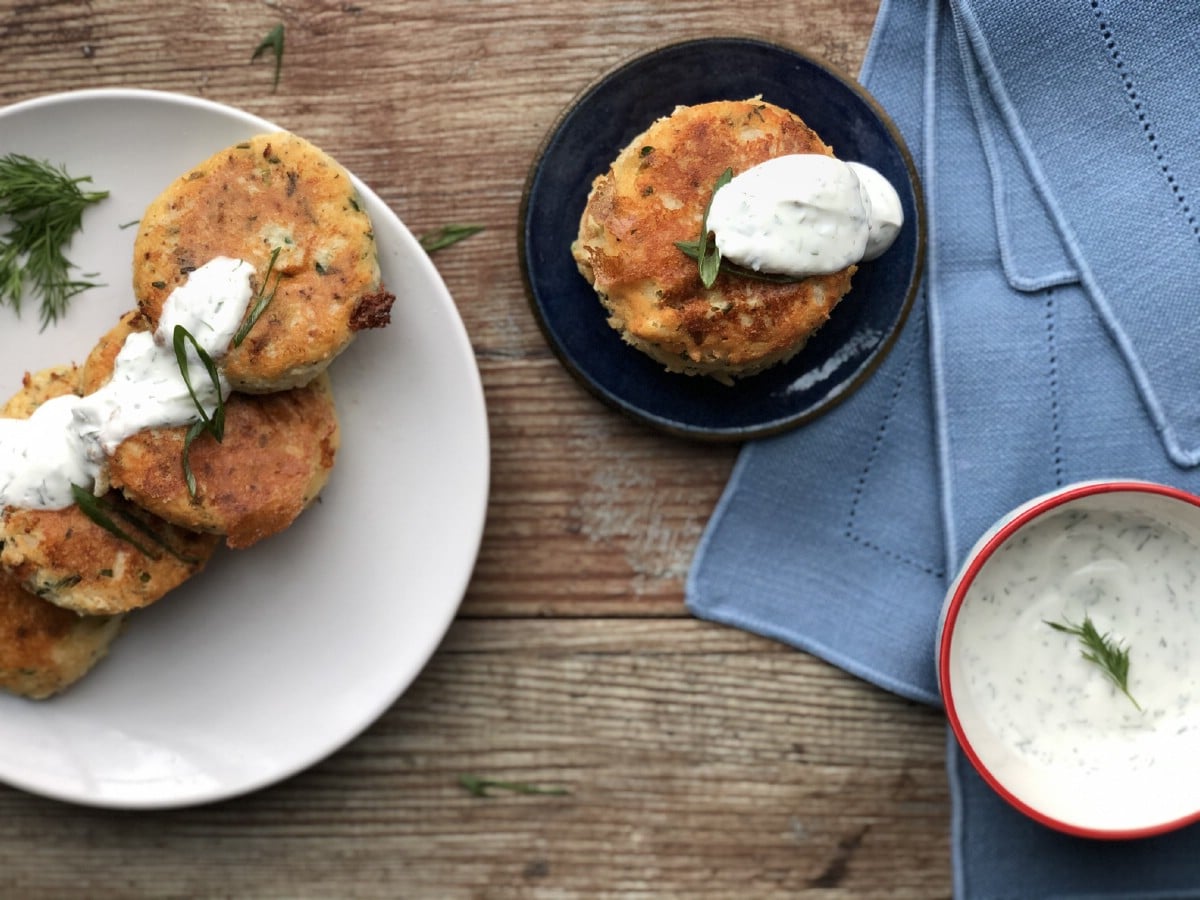 Potato cakes on plate with dill sauce