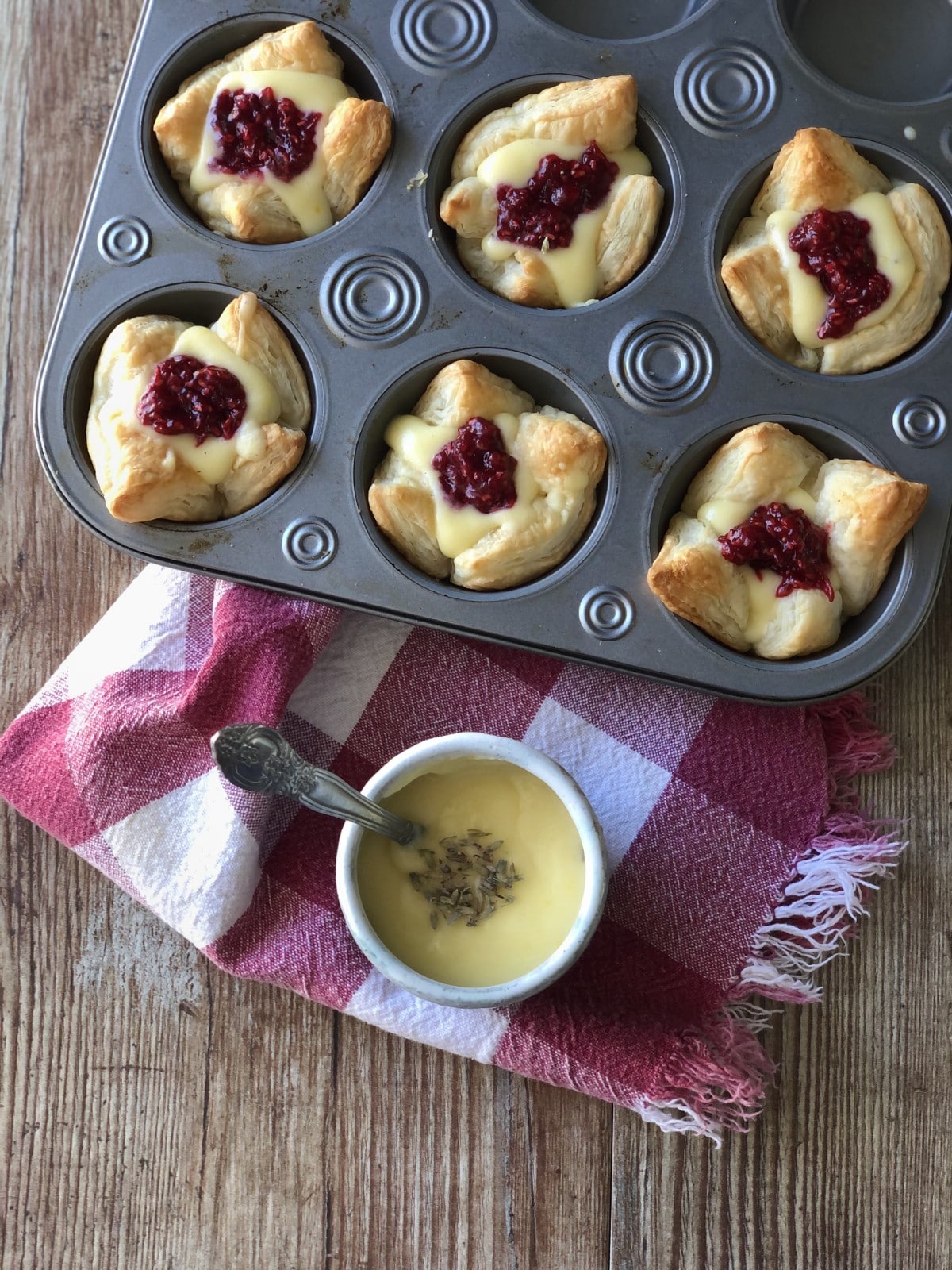 Tarts in muffin tin with sauce on the side