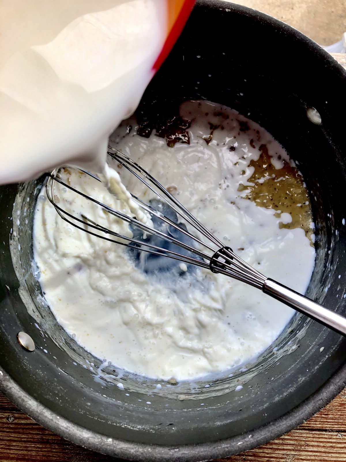 Adding milk to flour
