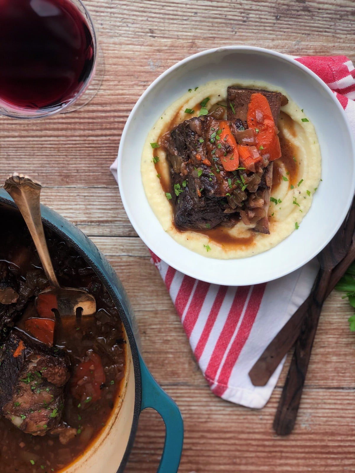 Short ribs in dutch oven by white bowl