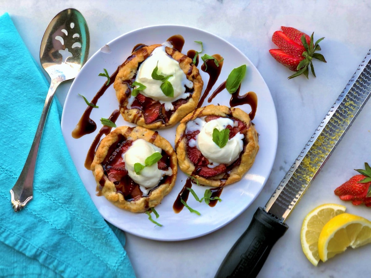 Strawberry balsamic galettes on white plate