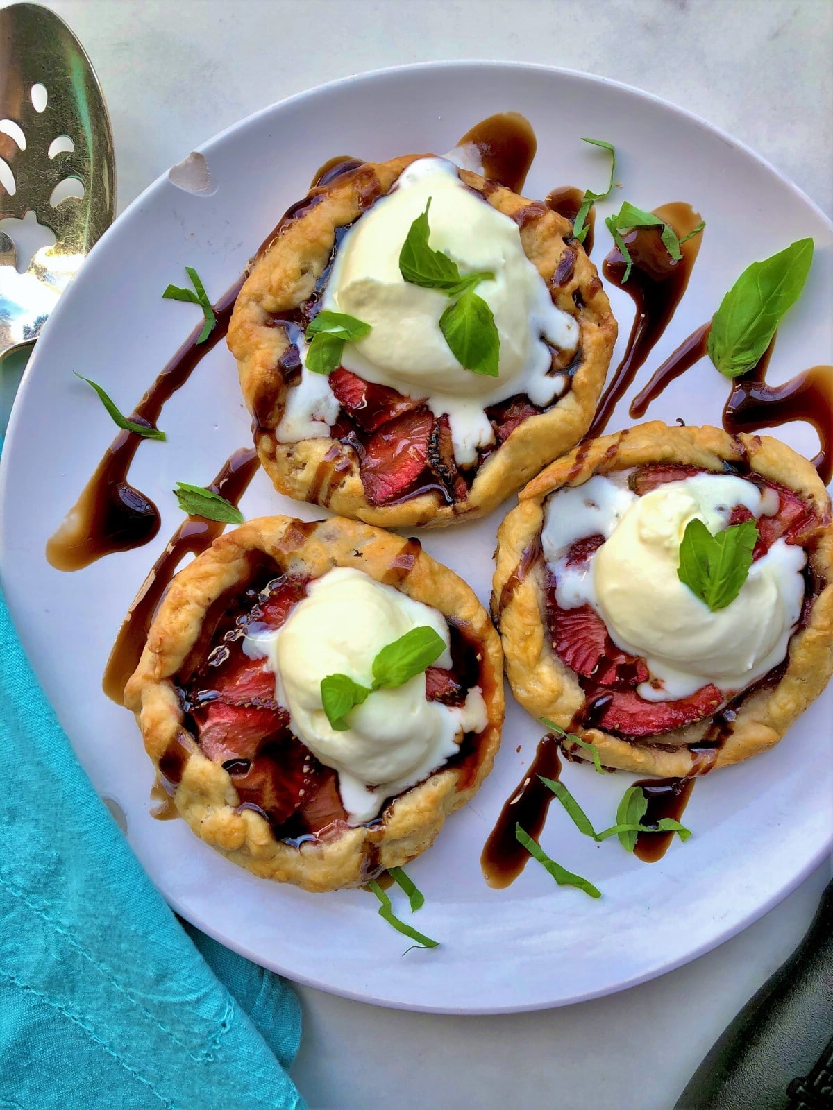 Strawberry balsamic galettes on white plate