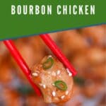 Chopsticks holding bourbon chicken