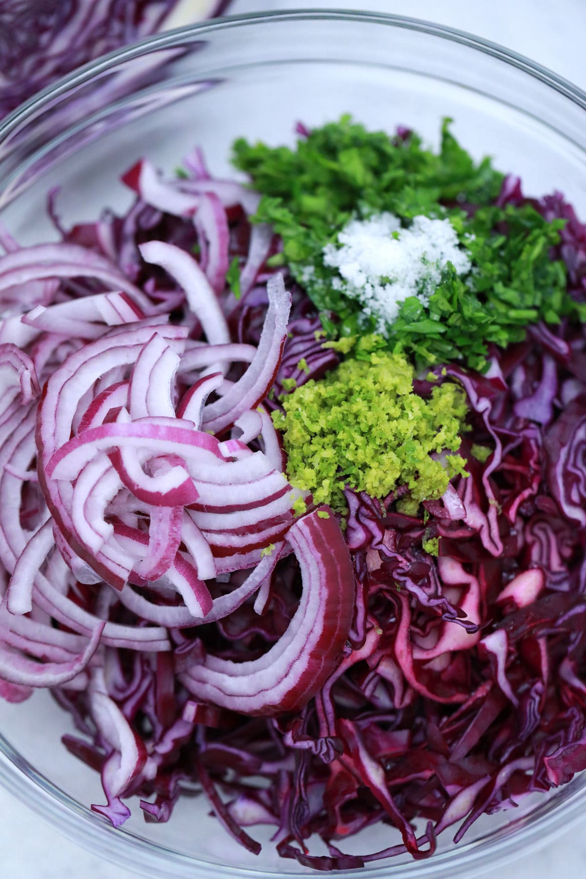 Cabbage slaw ingredients in large bowl
