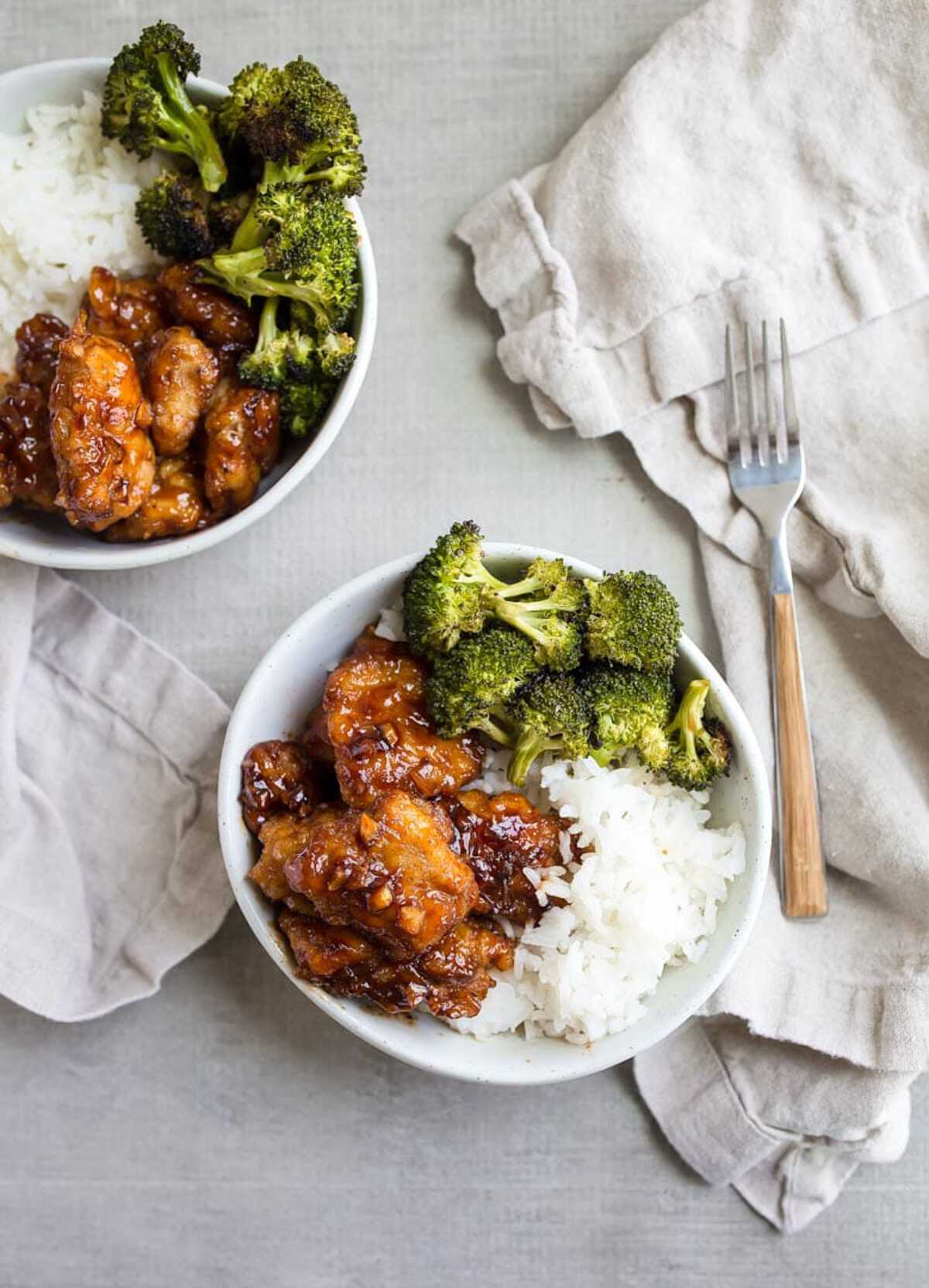 Chicken with rice and broccoli on white plate