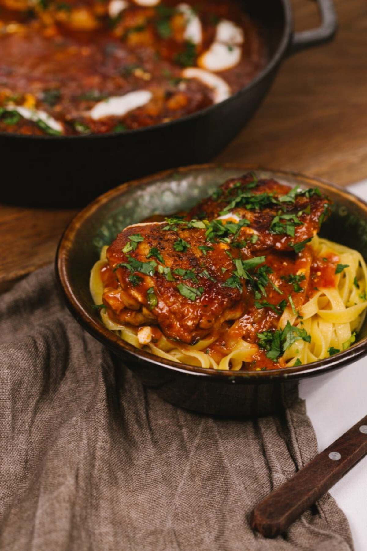 Chicken paprikash in bowl with noodles