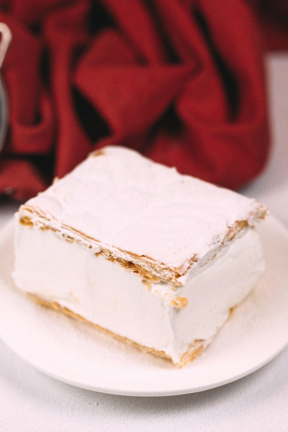 Puff pastry cake on white plate