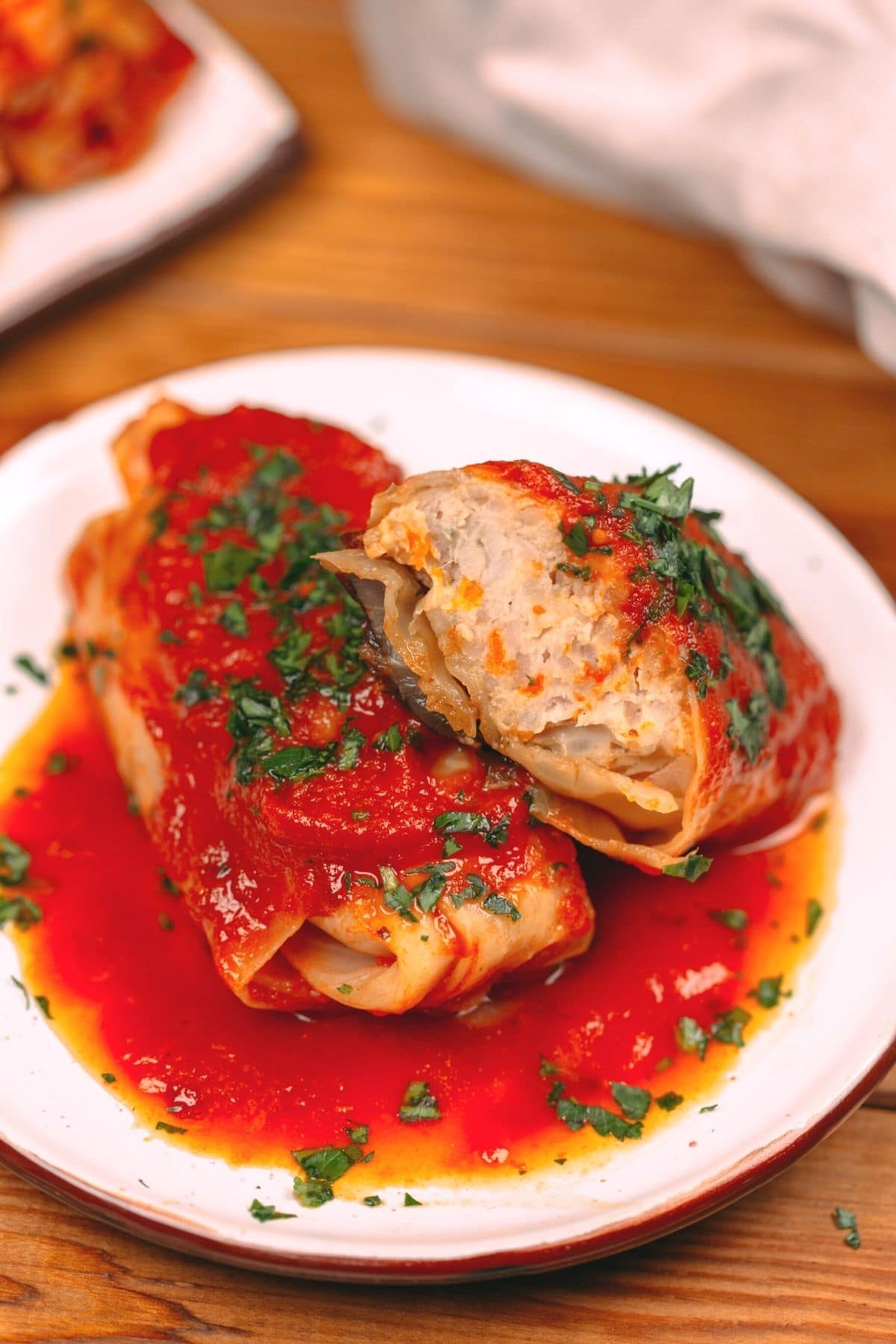Stuffed cabbage rolls on white plate